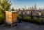 Illustrative rooftop hives with the NYC skyline