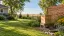 Illustration of a closed beehive in a prairie garden with open inspection space