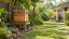 Illustration of a closed timber beehive and a water bowl in a tropical garden